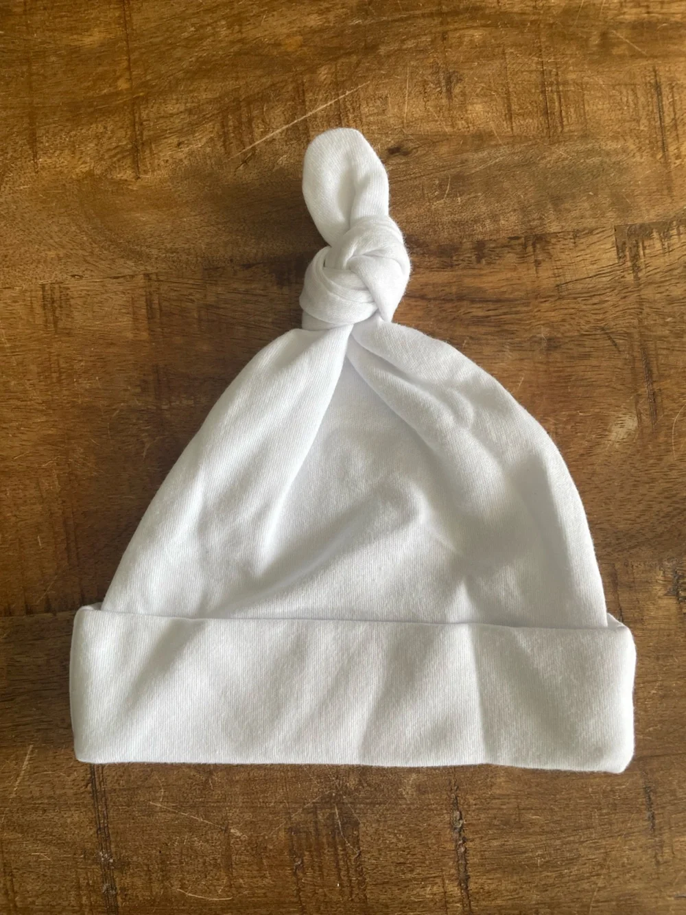 Personalized White Baby Knot Hat with Blue “Austin” Embroidery